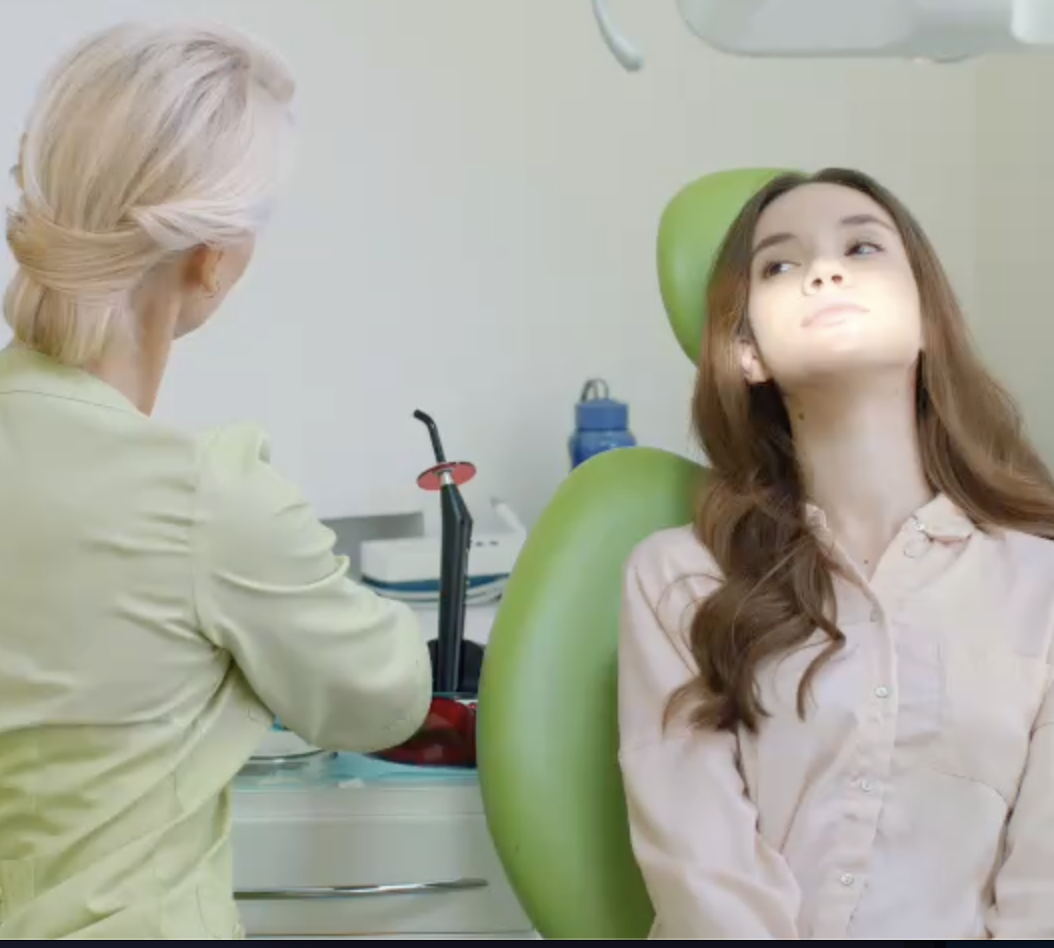 Dental professionals performing implant surgery